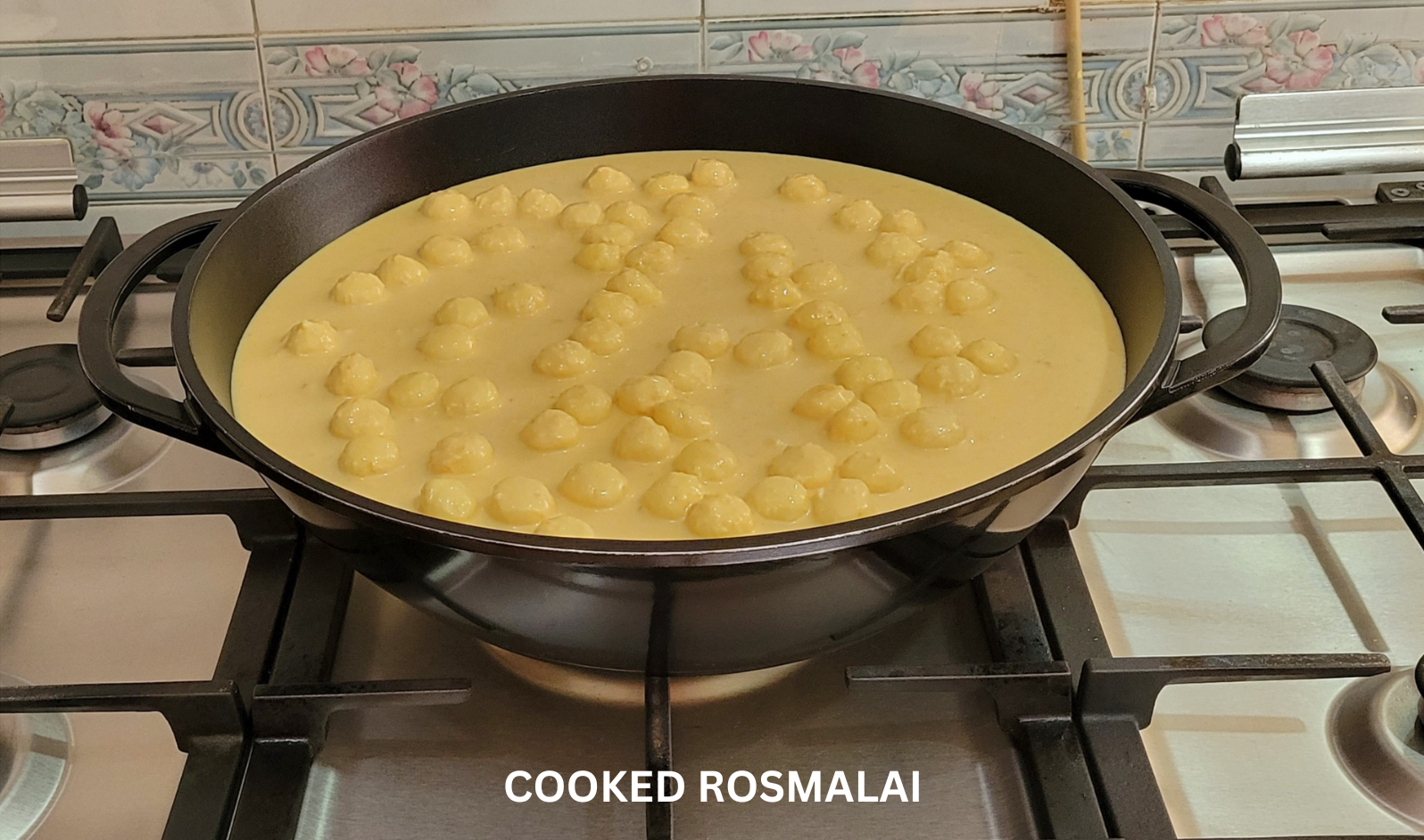 Cooked Rasmalai in controlled reduction — process shot